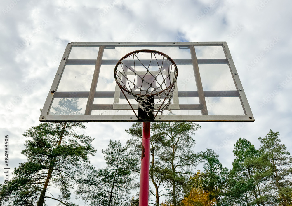 Basketball hoop against the background of the sky with clouds Basketball hoop against the background of the sky with clouds