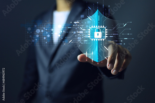 Cyber security concept with businessman pointing on log shield to protect data information from virus or hacker to cyber crime and complied with ISO 27001 information security management systems ISMS