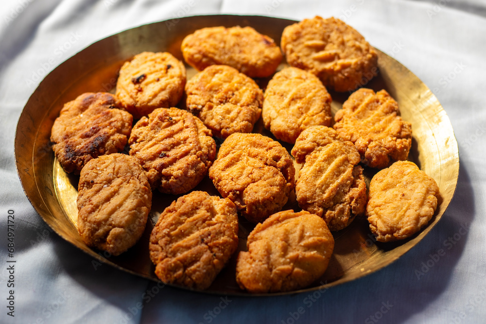 Thekua is an Indian sweet dish.popular in uttarpradesh, bihar and jharkhand.offering for the chhat festival. Thekua is an Indian sweet dish.popular in uttarpradesh, bihar and jharkhand.offering for the chhat festival.