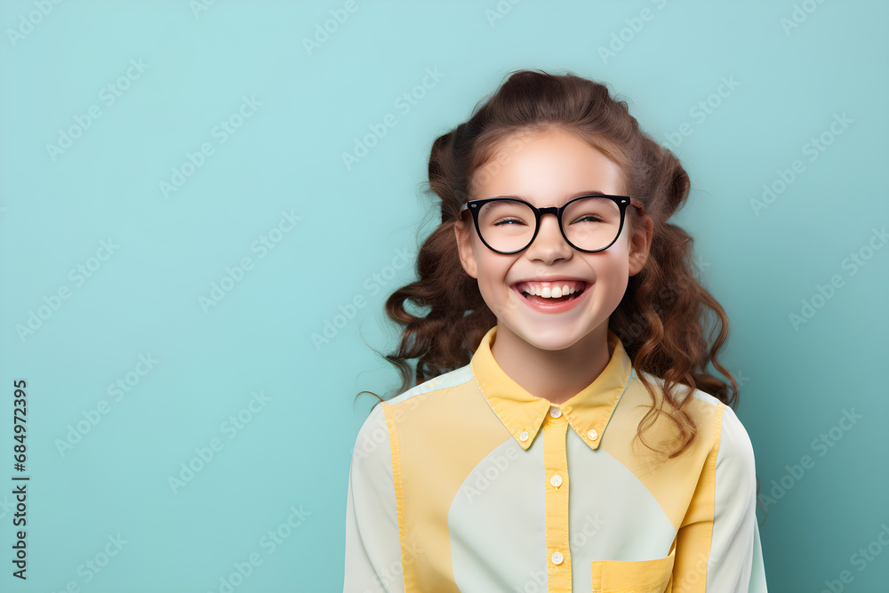 portrait of happy nerdy girl isolated on blue background