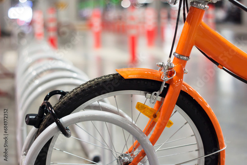 Bicycle in rack close-up blurred background, bicycle for rent, Travel business , Transportation, Sport or leisure concept