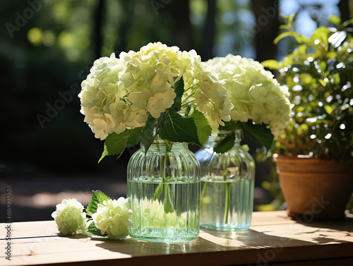 Bottle of Absinthe with Lime Slices and Flowers on a Windowsill photo