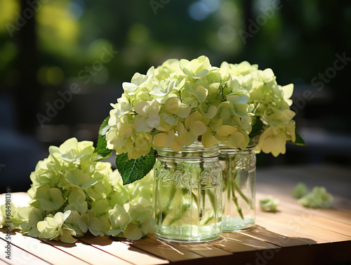 Bottle of Absinthe with Lime Slices and Flowers on a Windowsill photo