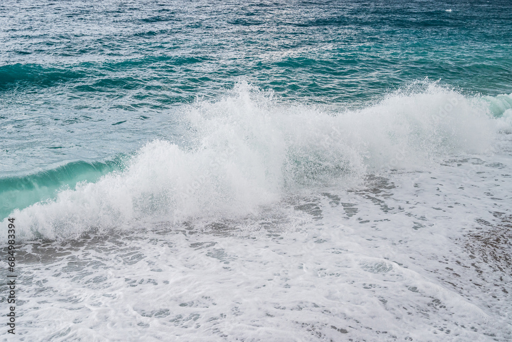 Fototapeta premium big waves hitting the Konyaalti coast on a stormy day