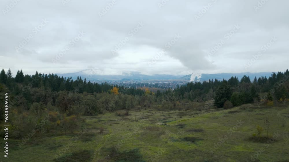 Drone shot flying over valley on a mountain on a cloudy day. Drone shot flying over valley on a mountain on a cloudy day.
