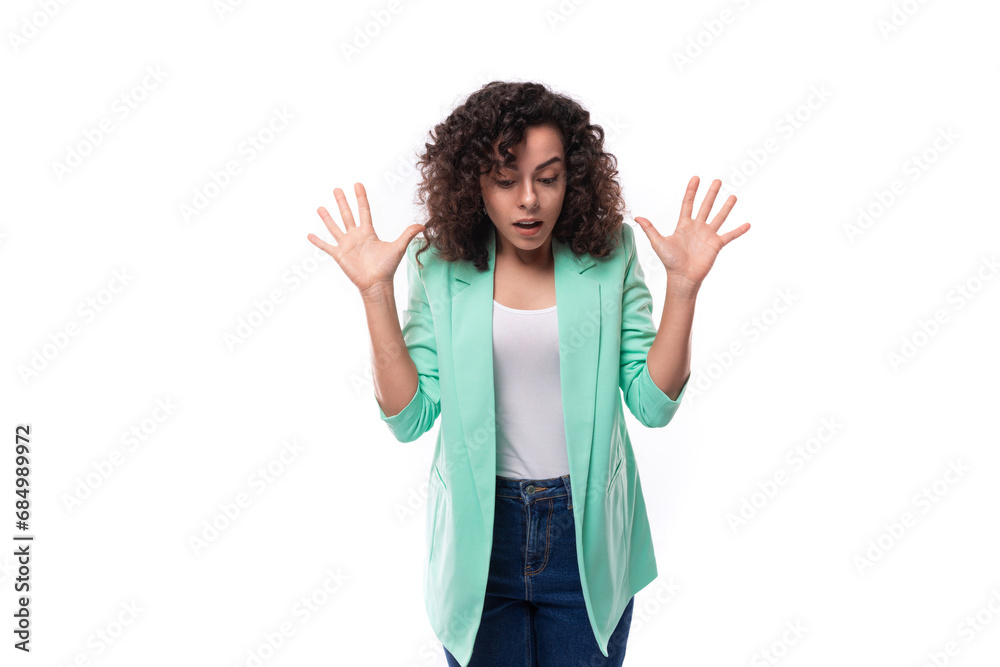 pretty young brunette curly businesswoman dressed in a blue jacket tells interesting news pretty young brunette curly businesswoman dressed in a blue jacket tells interesting news