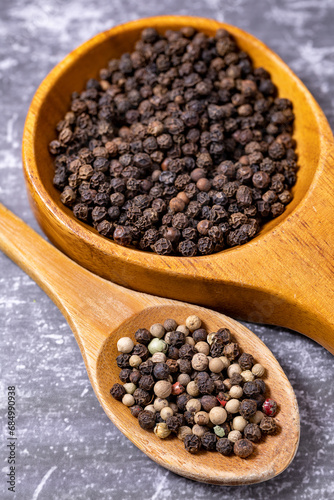 Black and white pepper spices isolated