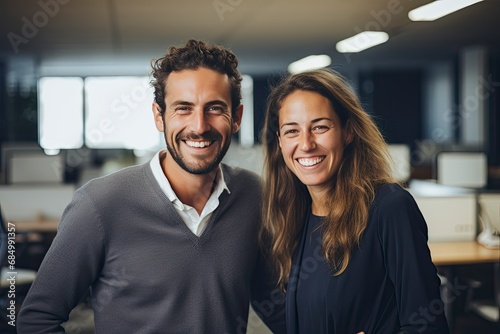 Smiling Business Man and Woman in Office