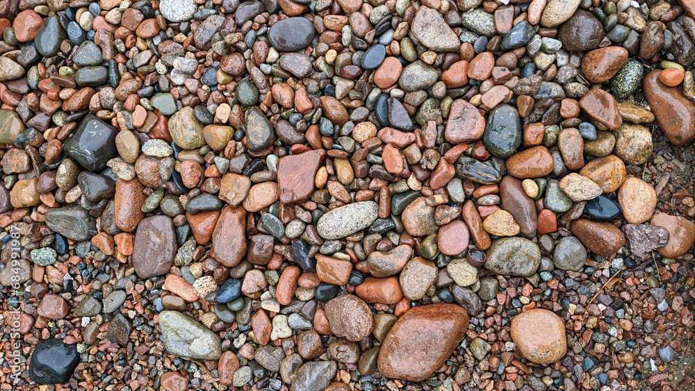 Naklejka premium Nature’s Mosaic: Wet Multicolored Pebbles