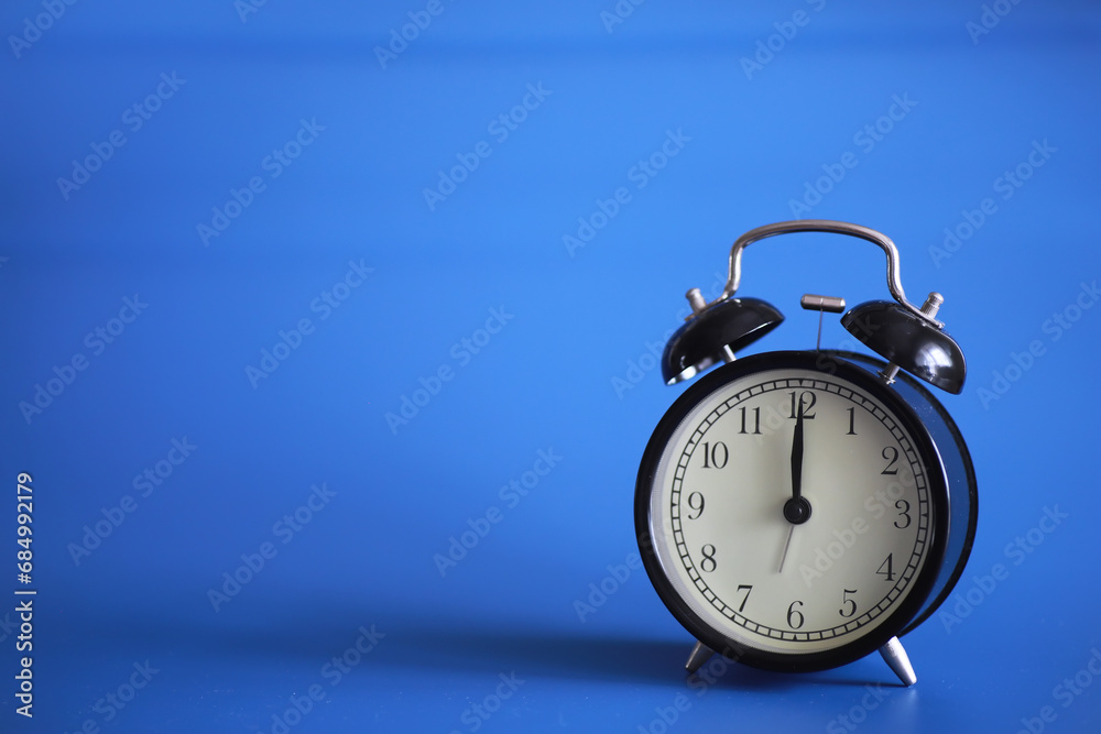 Alarm clock on the table. Time concept. Being late for work and school. Alarm clock on the table. Time concept. Being late for work and school.