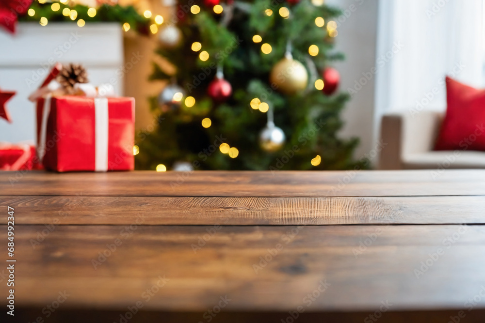 Close-up of an empty wooden table, in the blurred backgrounda a living room with christmas tree and a window Close-up of an empty wooden table, in the blurred backgrounda a living room with christmas tree and a window