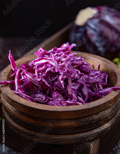 Chopped red cabbage in a wooden bowl