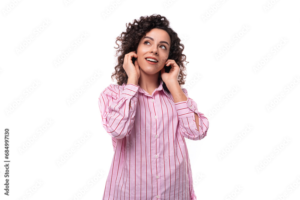 successful young office secretary woman dressed in a striped pink shirt speaks on the phone successful young office secretary woman dressed in a striped pink shirt speaks on the phone