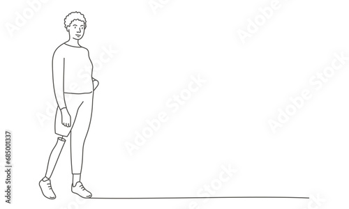 Woman with leg prosthesis standing.