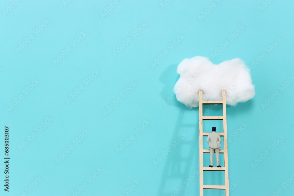 Concept image of ladder reaching the clouds, goal achieving and leadership idea Concept image of ladder reaching the clouds, goal achieving and leadership idea
