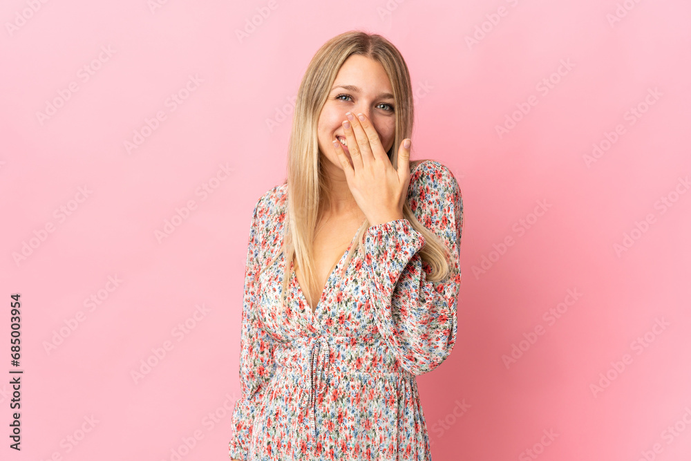 Young blonde woman isolated on pink background happy and smiling covering mouth with hand Young blonde woman isolated on pink background happy and smiling covering mouth with hand