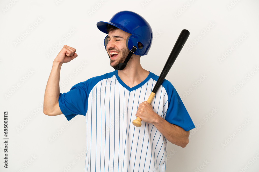 Young caucasian man playing baseball isolated on white background celebrating a victory Young caucasian man playing baseball isolated on white background celebrating a victory