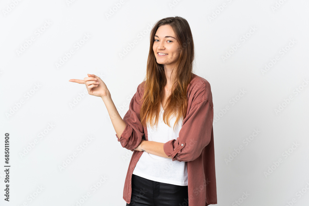 Young Ireland woman isolated on white background pointing finger to the side Young Ireland woman isolated on white background pointing finger to the side