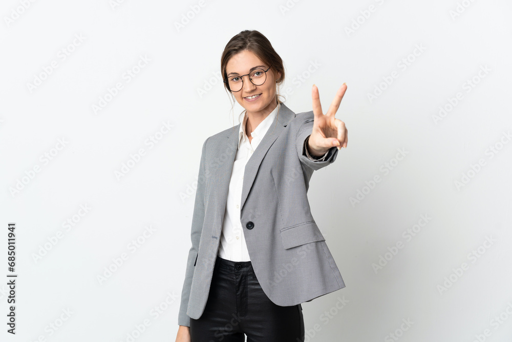 Business Ireland woman isolated on white background smiling and showing victory sign Business Ireland woman isolated on white background smiling and showing victory sign