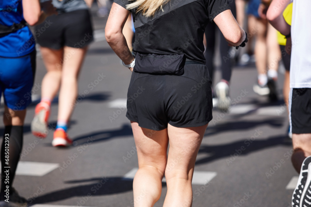 Runners on the street. Healthy lifestyle. Jogging exercise. Athletics Runners on the street. Healthy lifestyle. Jogging exercise. Athletics
