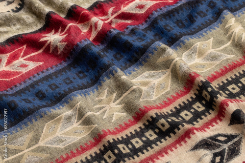 Woolen scarf with ethnic patterns as a background. Studio shot.