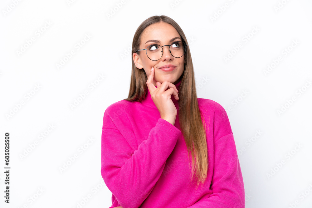 Young caucasian woman isolated on white background thinking an idea while looking up Young caucasian woman isolated on white background thinking an idea while looking up