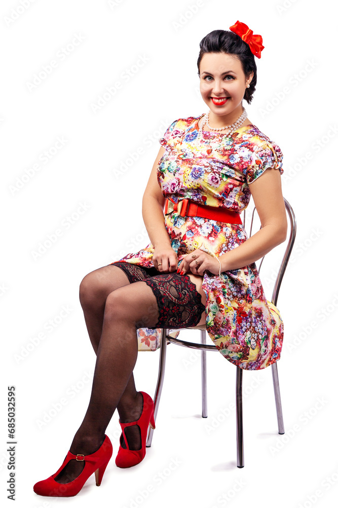 young girl adjusting her stocking while sitting on a chair