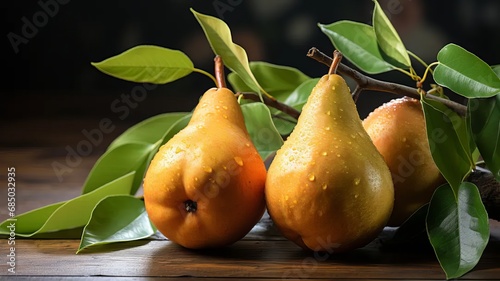 Fresh pears with leaves on a wooden table