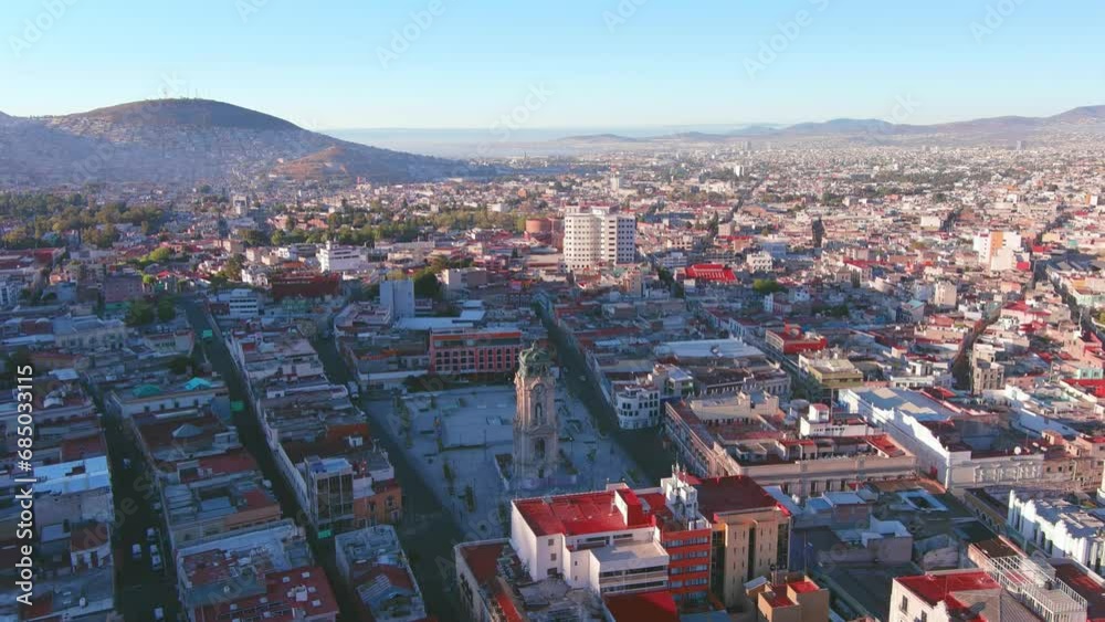 Mexico, Pachuca: Aerial view of capital city of Mexican state of Hidalgo at sunrise, Monumental Clock (Reloj Monumental de Pachuca) - landscape panorama of Latin America from above