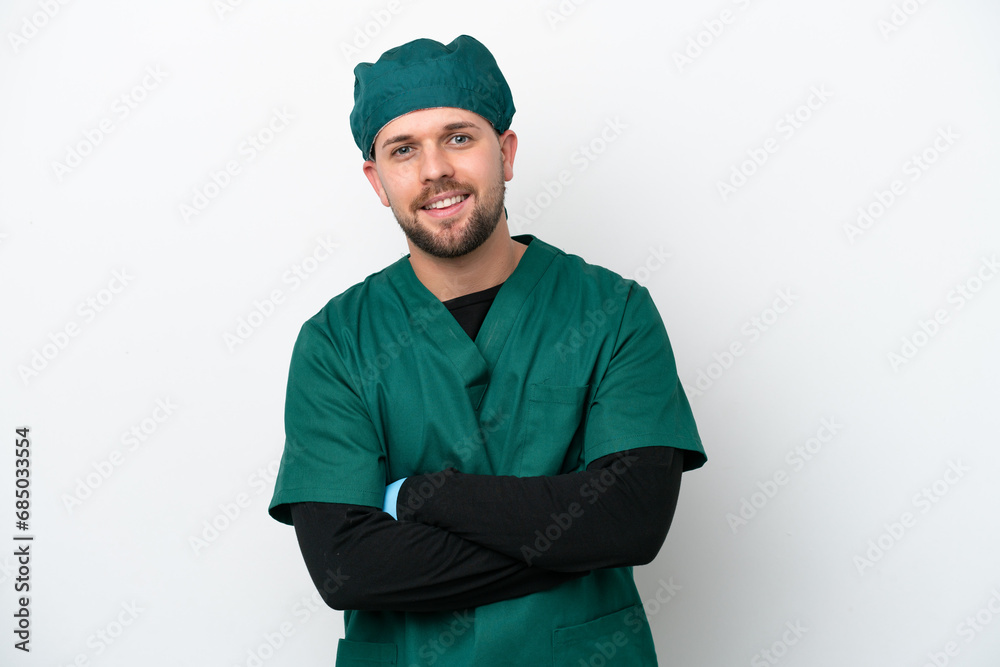 Surgeon in green uniform isolated on white background with arms crossed and looking forward Surgeon in green uniform isolated on white background with arms crossed and looking forward