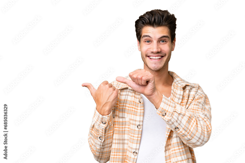 Young handsome caucasian man over isolated background pointing to the side to present a product Young handsome caucasian man over isolated background pointing to the side to present a product