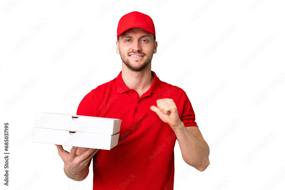 Pizza delivery man with work uniform picking up pizza boxes over isolated chroma key background proud and self-satisfied Pizza delivery man with work uniform picking up pizza boxes over isolated chroma key background proud and self-satisfied