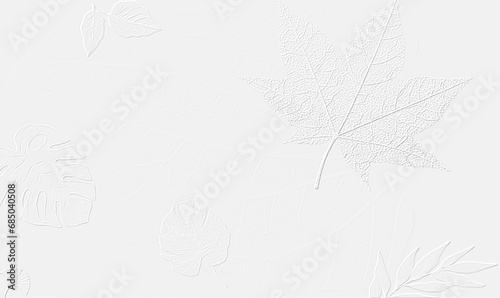 embossed image of leaves on a white paper photo