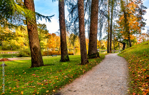 Gravel walkways in old public park at autumn