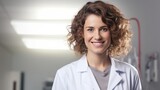 Smiling female doctor looking at camera on white background,