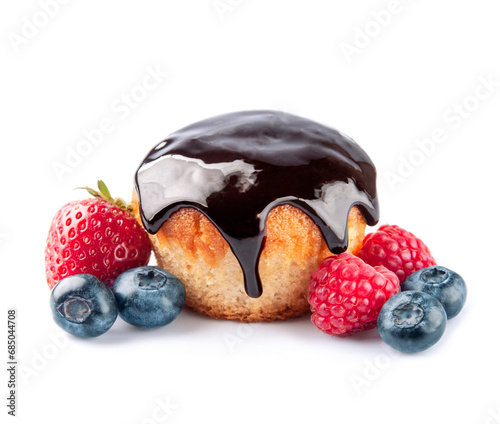 Cupcake in chocolate topping and berries photo