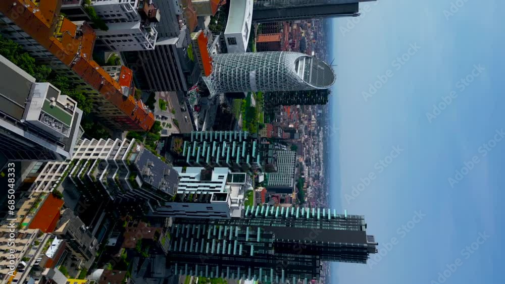 Milan, Italy 28.11.2023 Vertical video Aerial view Milan, Italy Porta Nuova. Bosco verticale 