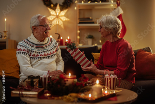 Grandma giving her husband a Christmas present