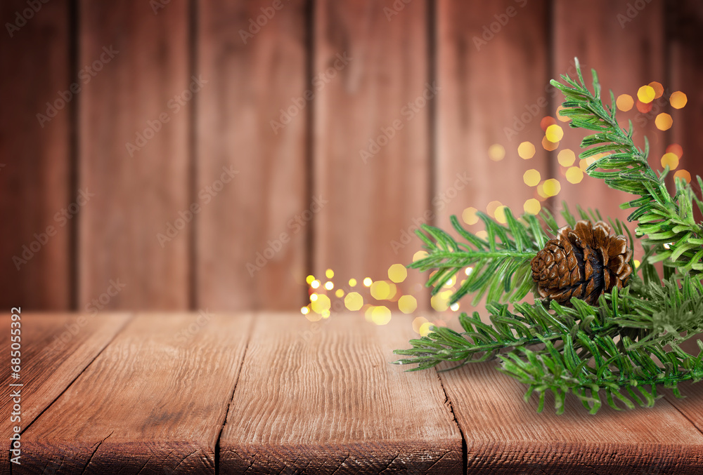Christmas Tree Branches and Pine Cone on Old Wooden Table Christmas Tree Branches and Pine Cone on Old Wooden Table