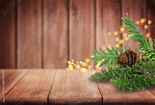 Christmas Tree Branches and Pine Cone on Old Wooden Table