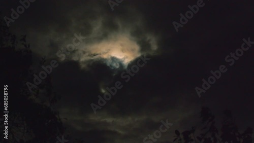 Dramatic and agic moment. Full moon and nice colors of the clouds.  photo