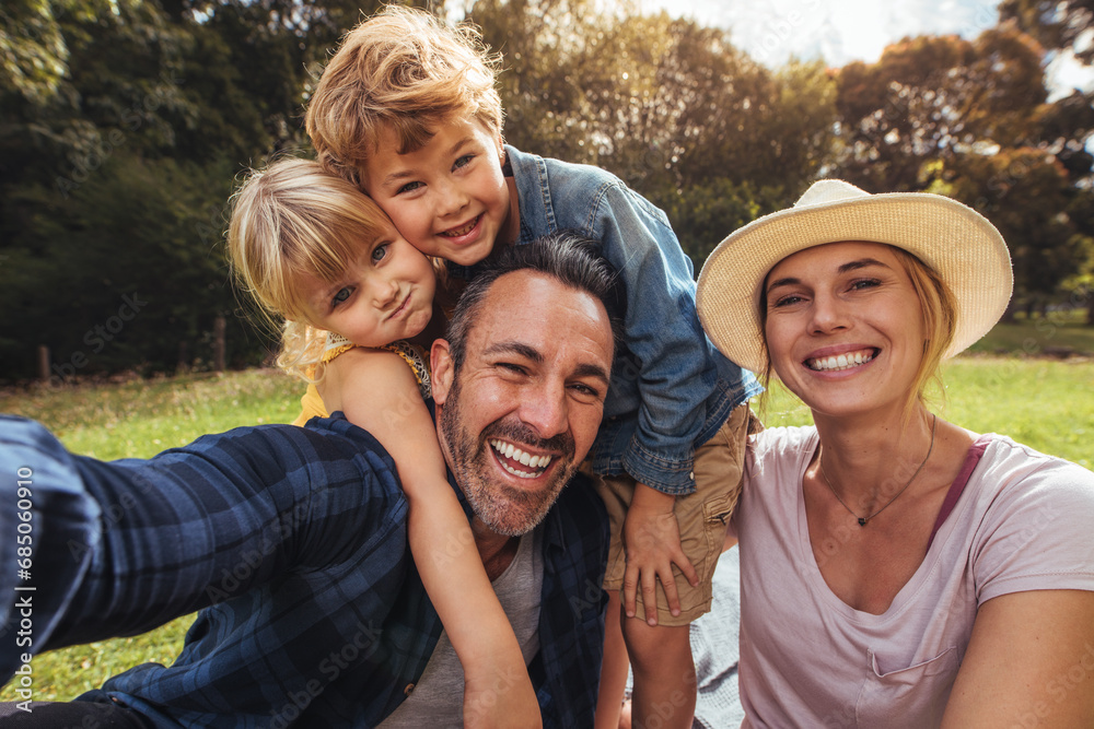 Cheerful family making selfie on picnic Cheerful family making selfie on picnic