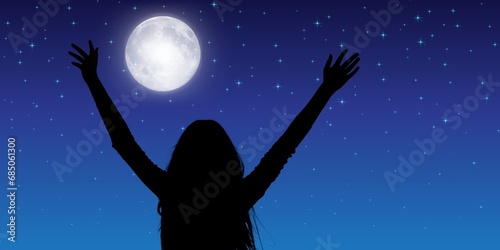 Woman meditating under glowing full moon