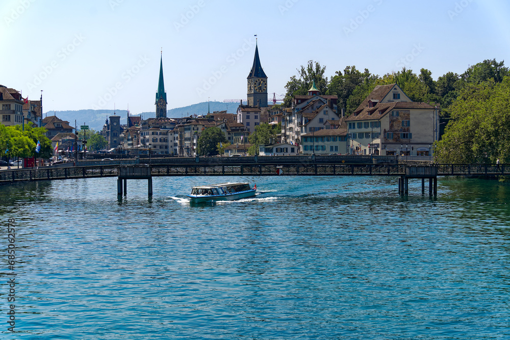 Scenic view of the old town of City of Zürich with Limmat River in the foreground on a hot sunny summer day. Photo taken July 11th, 2023, Zurich, Switzerland.
