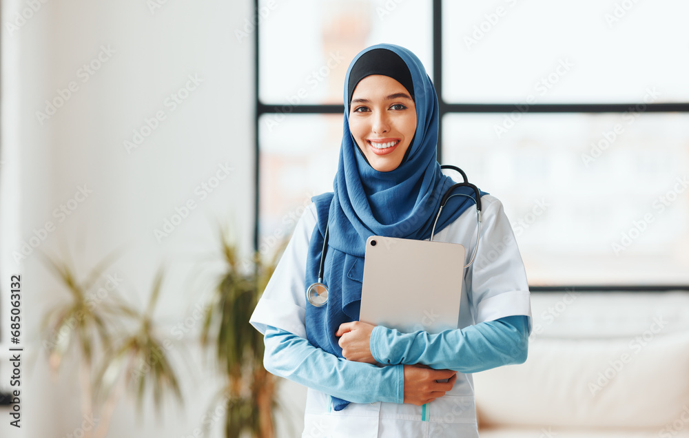 Professional woman doctor in muslim national hijab in hospital. Professional woman doctor in muslim national hijab in hospital.