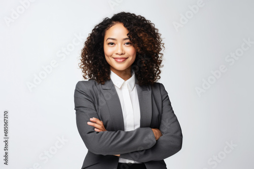 Portrait of Smiling Asian businesswoman on plain background