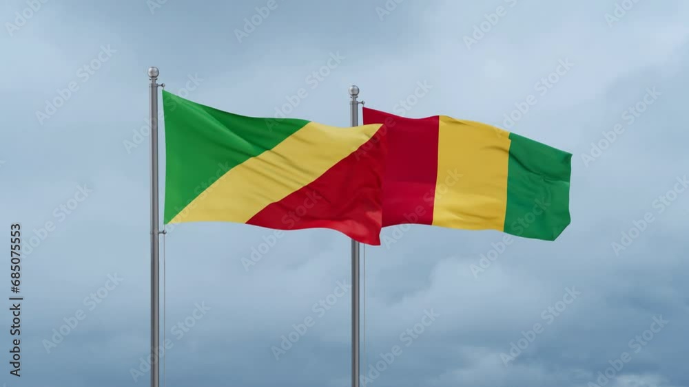 Republic of Guinea flag and Congo-Brazzaville flag waving together on cloudy sky, endless seamless loop, two country relations concept Republic of Guinea flag and Congo-Brazzaville flag waving together on cloudy sky, endless seamless loop, two country relations concept