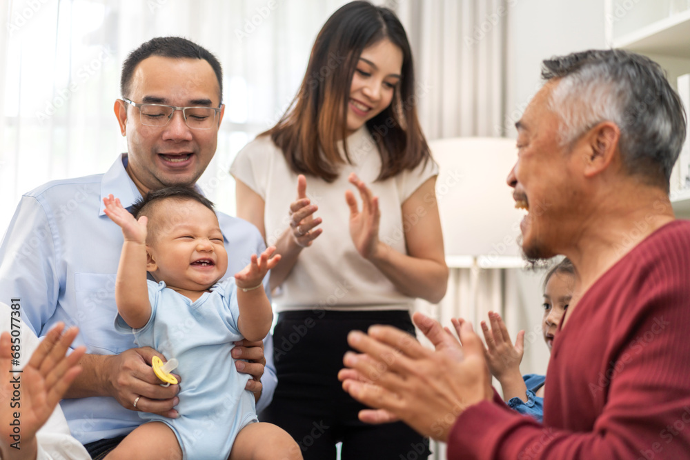 Portrait of happy love family asian father and mother playing with adorable asian baby and sister girl.newborn, infant.mom touching with cute son moments good time with grandparents.Love of big family Portrait of happy love family asian father and mother playing with adorable asian baby and sister girl.newborn, infant.mom touching with cute son moments good time with grandparents.Love of big family