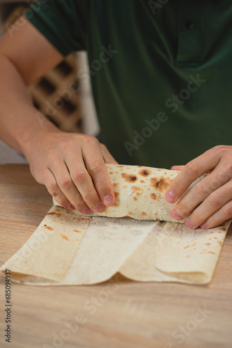 Man cooking homemade falafel in pita. photo