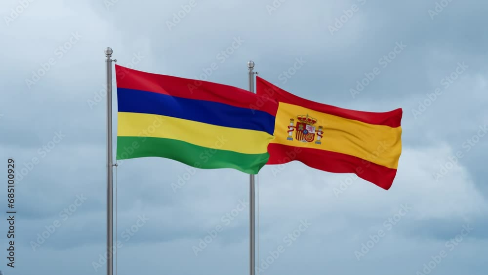 Spain and Mauritius flag waving together on cloudy sky, endless seamless loop, two country cooperation concept Spain and Mauritius flag waving together on cloudy sky, endless seamless loop, two country cooperation concept